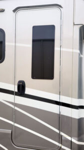 2020 Winnebago Tour entry door window replaced